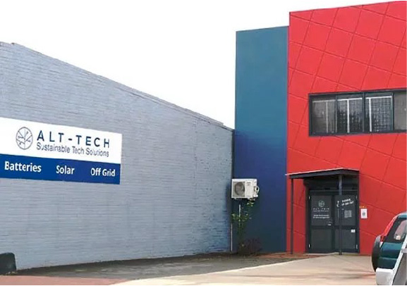 The Alt-Tech Storefront stands out in red next to a grey wall featuring the Alt-Tech Signage